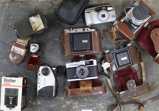 A collection of cameras and equipment